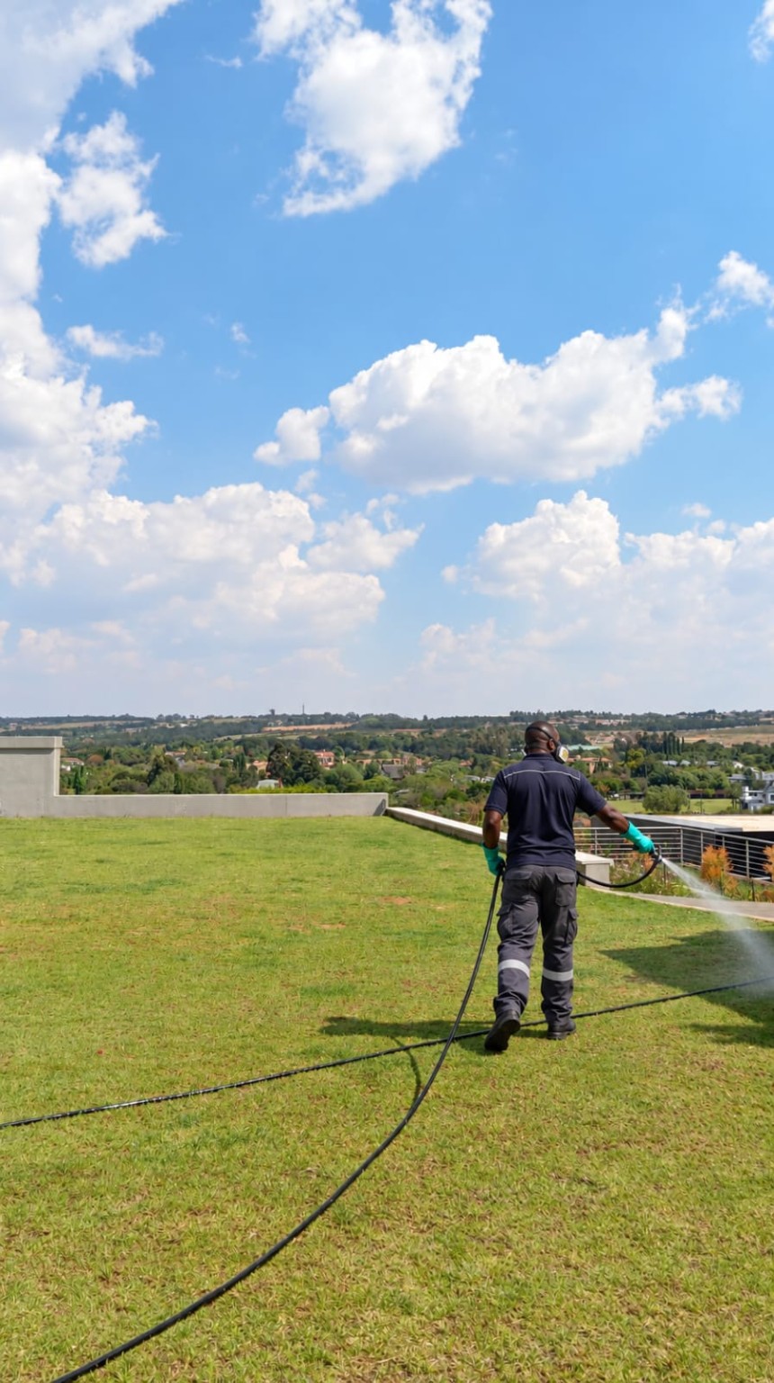Mr. Weed & Insect technician applying a garden treatment at a Mooikloof property